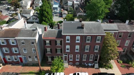 Aerial-truck-shot-of-lines-of-tall-townhome-apartments