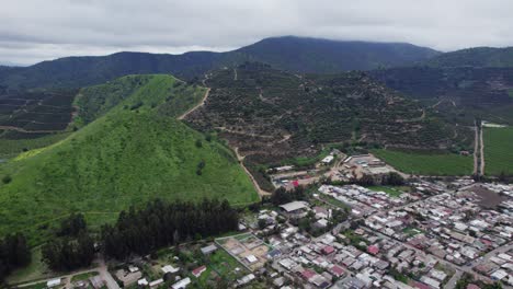 Idyllic-Mountains-And-Chilean-Town-Of-Pomaire-On-A-Cloudy-Day---aerial-drone-shot