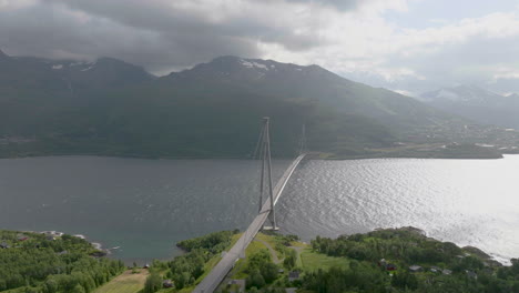 Panoramic-view-of-Halogaland-suspension-bridge-crossing-Rombaksfjord,-aerial