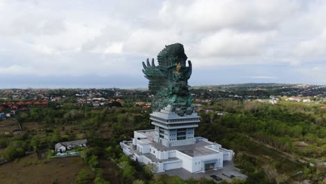 Majestic-ancient-historic-statue-in-Bali-island,-aerial-drone-view