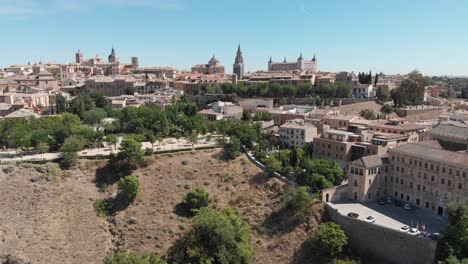 Toledo-city-and-Cathedral-rising-reveal-on-a-warm-sunny-day-with-brown-tones