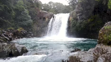 Aerial-pull-back-from-famous-tourist-attraction-of-Gollum's-Pool-from-Lord-of-the-Rings-movie-set,-New-Zealand