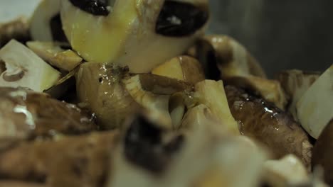 Close-up-on-champignon-mushrooms-poured-with-olive-oil