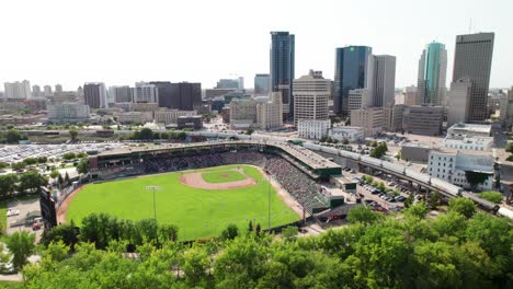 Beautiful-drone-shot-of-baseball-game-in-downtown-Winnipeg,-Canada