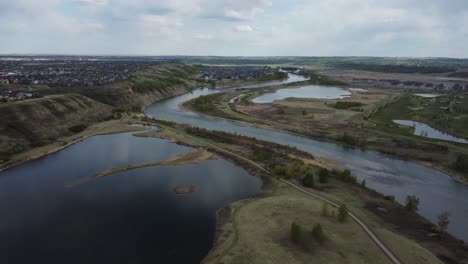 Hilly-residential-area-surrounded-with-ponds-and-bike-path