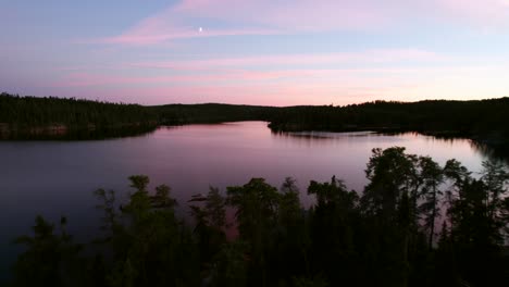 Treetops-and-wilderness-lake-at-sunset.-Natural-beauty