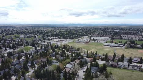 Community-in-sunny-weather-and-mountains-on-background-from-air