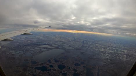 Flying-through-clouds-to-reveal-Wapusk-National-Park-flyover-time-lapse-near-Churchill-Manitoba-Northern-Canada