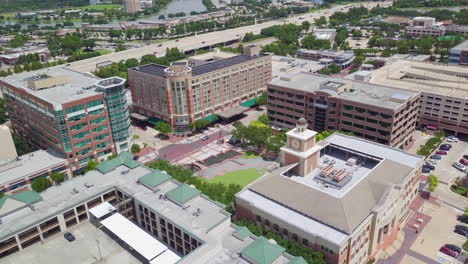 Drone-Shot-Revealing-the-Sugar-Land-City-Hall-in-Houston-Texas,-Freeway-I-69