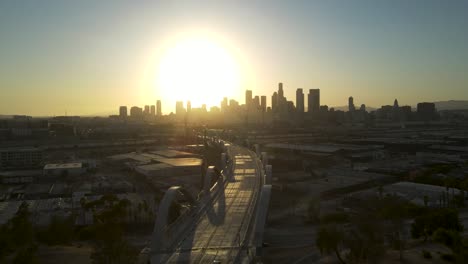 Aerial-view-of-Downtown-Los-Angeles-on-the-6th-Street-Bridge,-Cityscape-Sunset-View