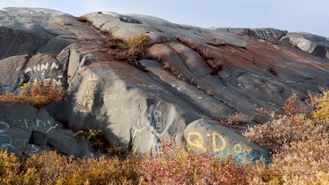 Graffitied-rocks-near-Churchill-Manitoba-Canada-shores-of-Hudson-Bay-truck-right