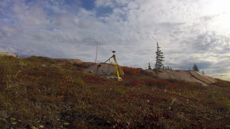 Time-lapse-of-Leica-GNSS-GPS-surveyor-base-station-on-tundra-near-Churchill-Manitoba-Northern-Canada-in-summer