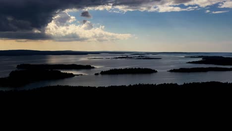 Aerial-hyperlapse-of-a-dramatic-clouds-moving-over-the-archipelago-in-Vardo,-Aland,-summer-in-Finland