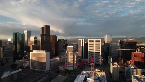 Aerial-panorama-of-a-crane,-skyscraper-construction-in-downtown-Denver,-Colorado-2