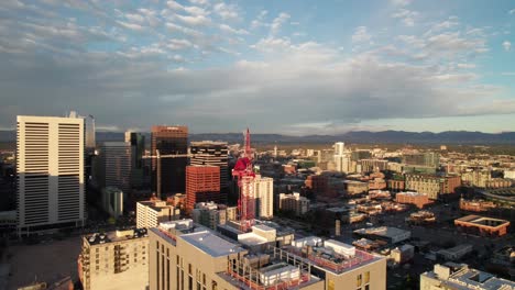 Aerial-panorama-of-a-crane,-skyscraper-construction-in-downtown-Denver,-Colorado-1