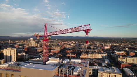 Aerial-panorama-of-a-crane,-skyscraper-construction-in-downtown-Denver,-Colorado