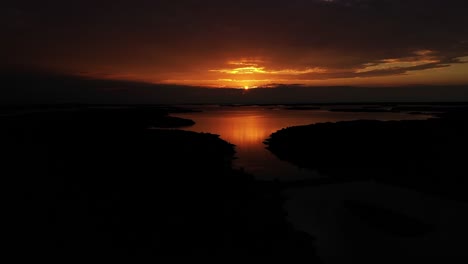 Aerial-view-of-a-dramatic-sunset-above-the-archipelago-in-Vardo,-Aland,-summer-in-Finland