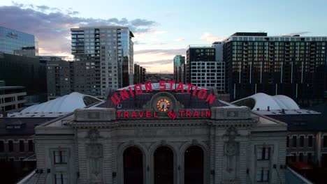 Travel-by-Train,-classic-Neon-sign-and-train-station