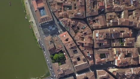 Vertical-aerial-of-old-world-Florence-rooftops-along