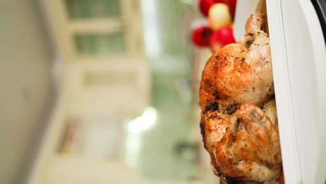 vertical-shot-of-delicious-Roasted-whole-chicken-on-thanksgiving-dinner