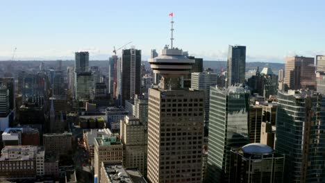 Aerial-of-Lookout-Tower-of-Harbour-Centre-in-Vancouver,-Canada---drone-shot