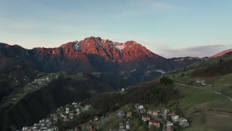 Beautiful-aerial-view-of-the-Seriana-valley-and-its-mountains-at-sunrise,-Orobie-Alps,-Bergamo,-Italy