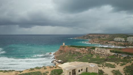 AERIAL:-Panoramic-Shot-of-Ghajn-Tuffieha-Bay-on-a-Stormy-Day