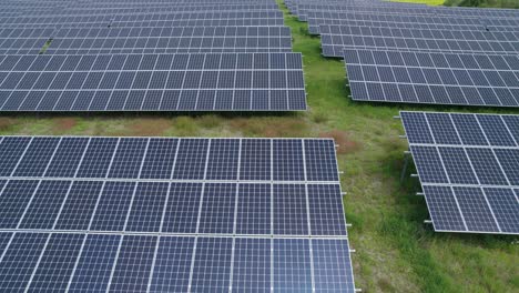 Aerial-trucking-close-shot-of-the-solar-panels-in-the-photovoltaic-power-plant