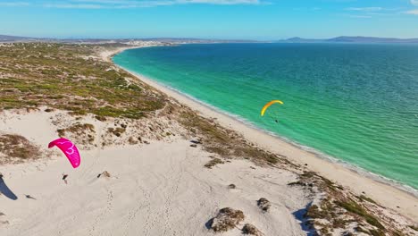 Paragliders-in-action-on-the-water-in-the-Langebaan-lagoon,-South-Africa