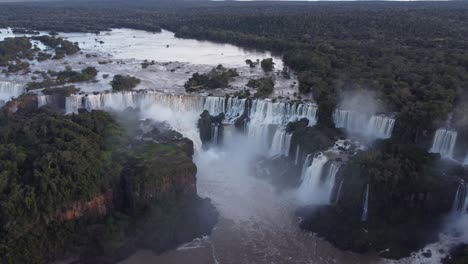 Drone-orbit-of-giant-crashing-Iguazu-Falls,-border-between-Brazil-and-Argentina---Panoramic-view