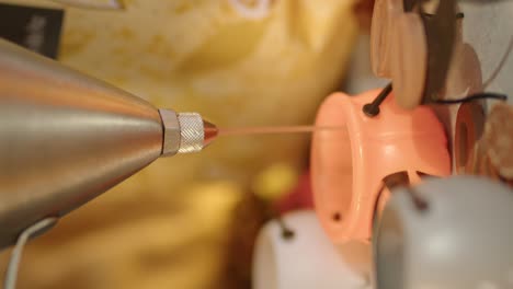 Close-up-shot-of-melted-caramel-sauce-poured-into-a-small-Halloween-pumpkin-before-Halloween-party