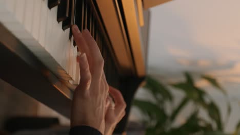 Vertical-Shot-Of-Female-Hands-Gently-Playing-Melody-On-Piano