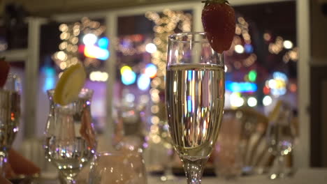 Slider-Shot-of-a-Champagne-Glass-full-with-Bokeh