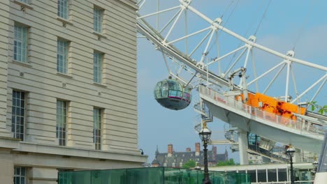 Slow-motion-close-up-pan-of-The-Millennium-Wheel-on-a-summer's-day-with-blue-skies,-shot-on-RED-Scarlet-W-5K