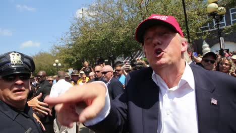 Presidential-Candidate-Donald-Trump-Walks-Through-A-Crowd-Of-Supporters-At-A-County-Fair-Political-Rally-During-The-Republican-Iowa-Caucus-Primary-Campaign