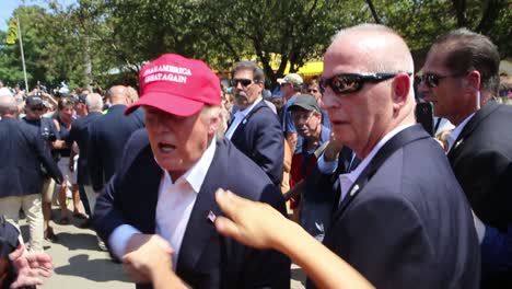 Presidential-Candidate-Donald-Trump-Walks-Through-A-Crowd-Of-Supporters-At-A-County-Fair-Political-Rally-During-The-Republican-Iowa-Caucus-Primary-Campaign