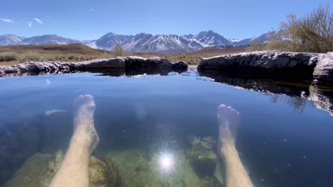 A-Tourist-Enjoys-A-Hot-Spring-In-California'S-Sierra-Mountains