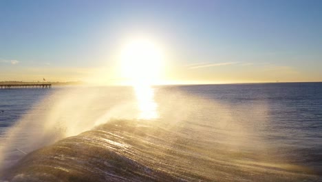 Aerial-Of-Surfer-Surfing-Riding-Large-Ocean-Waves-With-Surf-Breaking-Off-The-Coast-Of-Ventura,-California