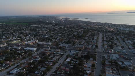 Good-Aerial-Over-Generic-California-Suburbia-Coastal-City-Town-Of-Ventura-At-Dusk-Or-Night-With-Suburban-Buildings-And-Traffic