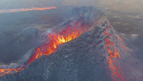 Amazing-Night-Drone-Aerial-High-View-Of-Active-Volcano-Crater-Fagradalsfjall-Volcano-With-Lava-Boulders-Falling-In-In-Iceland