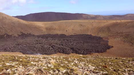 Tourists-Hike-Across-Distant-Mountains-To-Get-A-View-Of-The-Iceland-Fagradalsfjall-Volcanic-Eruption