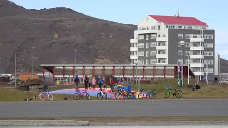 Kids-Play-And-Jump-On-A-Bounce-House-In-The-Town-Of-Grindavik,-Iceland