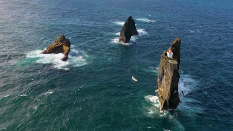 Remarkable-Aerial-Of-The-Pridrangaviti-Lighthouse-Perched-On-A-Remote-Rocky-Island-In-The-Atlantic-Ocean-Off-The-Coast-Of-Iceland