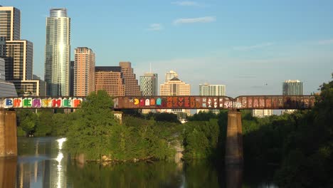 Good-Establishing-Shot-Of-Austin-Texas,-Train-Bridge,-Graffiti,-Downtown-Skyline