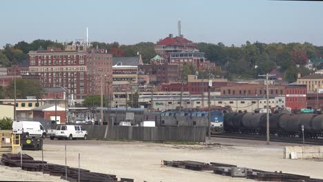 A-Long-Distance-Amtrak-Passenger-Train-Passes-Through-A-Railyard-Near-Burlington-Iowa