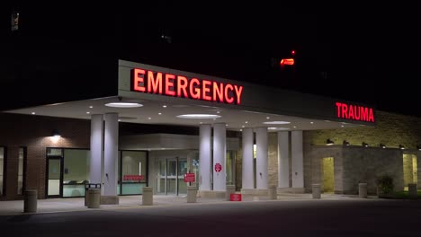 Good-Night-Establishing-Shot-Of-A-Generic-Modern-Hospital-With-Emergency-Room-And-Trauma-Center