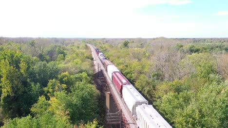 Aerial-Of-A-Freight-Train-Crossing-A-Steel-Railway-Bridge