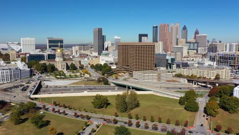 High-Angle-Aerial-Of-The-Atlanta-State-Capitol-Building-In-Atlanta,-Georgia-With-Traffic-And-Skyline-Background