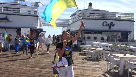 Ukrainian-Antiwar-Protesters-Chant-And-March-On-The-Malibu-Pier-With-Signs-And-Flags-To-Protest-The-Russian-Invasion-Of-Ukraine