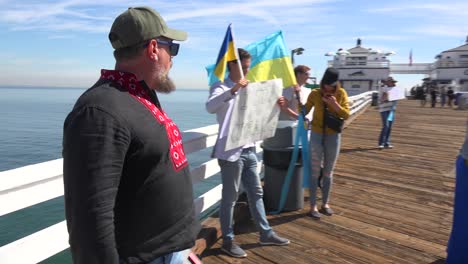 Ukrainian-Antiwar-Protesters-Chant-And-March-On-The-Malibu-Pier-With-Signs-And-Flags-To-Protest-The-Russian-Invasion-Of-Ukraine